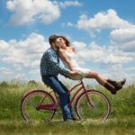 happy couple on a bike